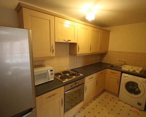 Kitchen with fridge freezer, oven and washer dryer